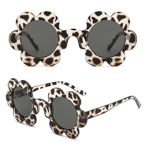Detailed front and side view of leopard print flower shaped sunglasses for kids