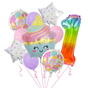 Detail of rainbow gradient number 1 balloon and smiling cupcake foil balloons for birthday party