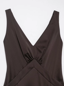 Detail of elegant V-neck and ruched chest design on a brown satin finish evening dress