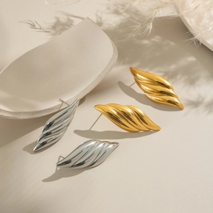 Minimalist textured leaf stud earrings in gold and silver finish for a modern look