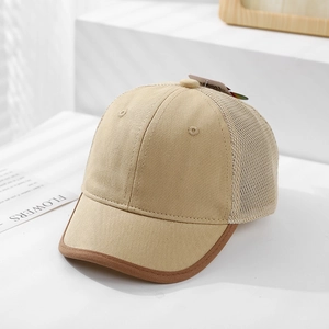 Detail of breathable mesh back and khaki cotton front on a kids baseball sun hat