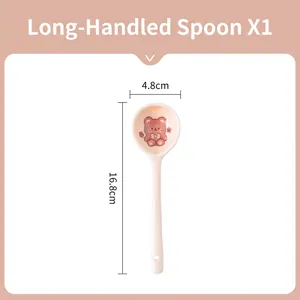 Detail of ceramic long handle spoon with red bear cartoon pattern and hanging hole detail