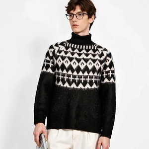 Close-up of black and white geometric diamond jacquard texture on men's knit sweater
