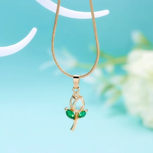 Detailed view of tulip pendant with green leaf and gold chain on light background