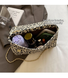 Detail of leopard print shoulder bag interior showing large capacity for daily essentials