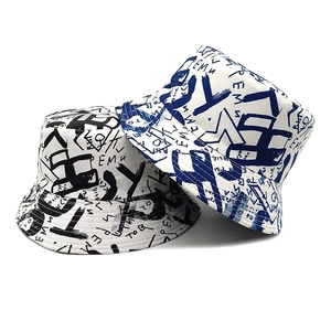 Graffiti print bucket hat with letter pattern in black and blue styles for sun protection