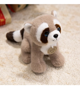 Close-up of fluffy raccoon plush toy with realistic fur texture and blue crystal eyes