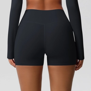 Macro detail of high-waist yoga shorts featuring V-shape back seam and peach lift effect