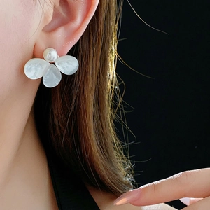Elegant flower stud earrings with white marble texture petals and a central pearl accent