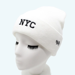 White knit beanie with NYC embroidery and classic ribbed cuff for casual winter style