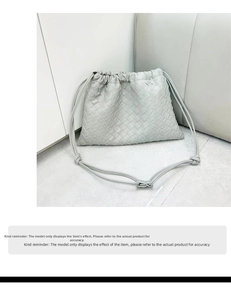 Detail of grey leather woven crossbody bag with drawstrings and Intrecciato pattern