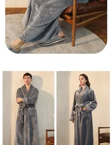 Detail of dark gray flannel bathrobe with plush texture, white trim, and belt closure