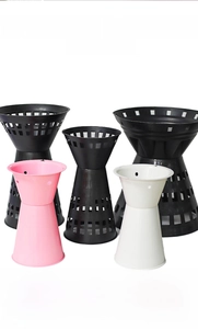 Tall bouquet floral arrangement stand in pink, white, and black with hollow grid design