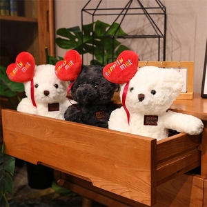 Three plush teddy bears with red hearts inside a wooden drawer, cozy gift scene