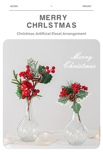 Christmas floral arrangement with red berries, pine cones and mushrooms in glass vases