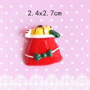 Detail of 2.4x2.7cm red Christmas resin gift bag with green bow for DIY crafts