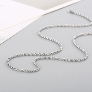 Detailed view of polished silver twisted rope chain necklace made of stainless steel