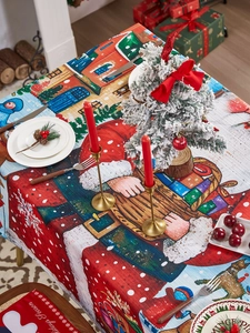 Detailed Christmas tablecloth featuring Santa, reindeer, and snowy houses in holiday scene