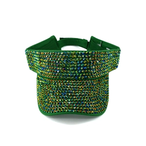 Detailed view of green visor hat embellished with colorful sparkling rhinestones