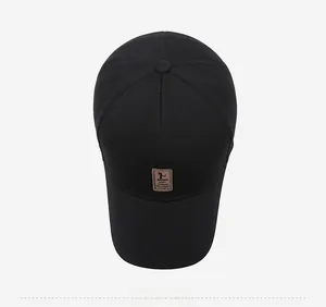 Top view of black baseball cap with breathable pineapple mesh texture and brown leather patch