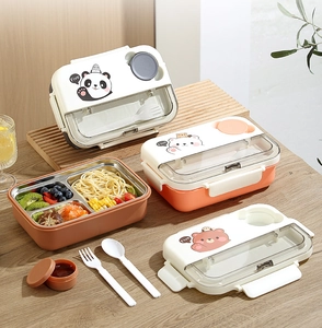 Detailed view of 3-compartment stainless steel bento box with cartoon bear lid and cutlery