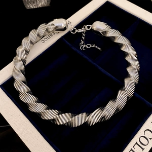 Exaggerated silver metallic spiral choker necklace with adjustable lobster clasp closure