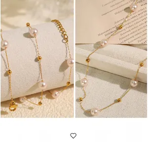 Detailed macro view of 18K gold star pearl necklace with lobster clasp and adjustable chain