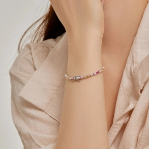 Close-up of S925 silver rainbow tennis bracelet with colorful heart zircons on wrist