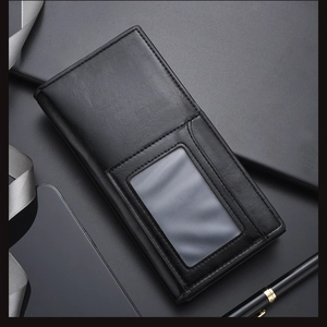 Macro view of black leather wallet with clear photo window and fine stitching detail