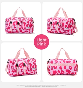 Detail view of pink leopard print travel bag showing compartments and luggage trolley strap