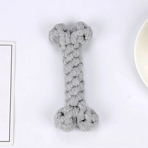 Detailed close-up of a bone-shaped grey cotton rope chew toy for dogs on white background