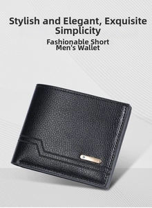 Detailed view of black litchi texture leather wallet with gold metal logo bar
