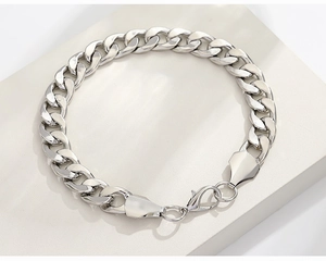 Detailed view of silver Cuban link chain bracelet with a secure lobster claw clasp
