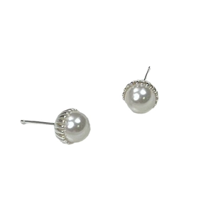 Elegant french style pearl stud earrings with silver metal base on white background