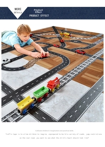 Detail showing DIY traffic road and railway tape stickers layout on indoor floor for kids