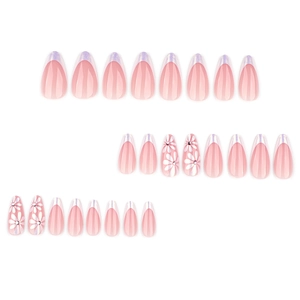 Almond shaped press-on nails in nude pink with purple french tips and white flower designs