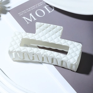 White matte hollow square hair claw clip with diamond pattern on aesthetic background