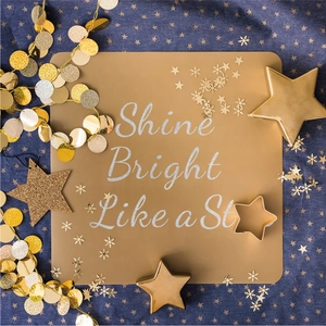 Detail of glitter gold star sticker with Shine Bright Like a Star text on blue fabric