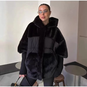 Women black hooded jacket with faux fur patchwork and ribbed knit cuffs in loose fit