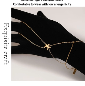 Detail of golden starfish hand chain on hand model with high quality metal texture