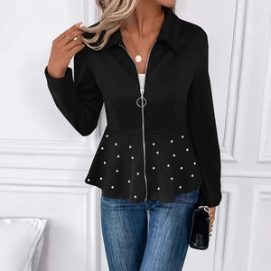 Detail of elegant black jacket with pearl beading, peplum hem and ring zipper closure