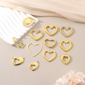 Flat lay of gold hollow heart-shaped charms with rhinestones for DIY jewelry making