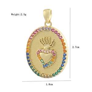 Macro view of gold heart pendant with rainbow zircons showing 2.7cm length details