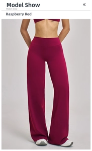 Detail of high-waist wide-leg raspberry red yoga pants with flattering drape fit