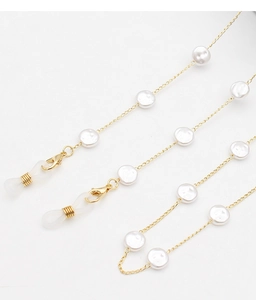 Detail of gold eyewear chain with white pearls, lobster clasp and silicone loops