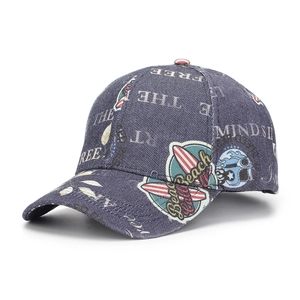 Close-up of vintage denim baseball cap with FREE THE MIND beach style graffiti print