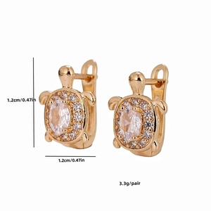 Detail view of golden turtle earrings with clear cubic zirconia and dimensions