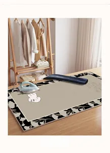 Detailed heat-resistant ironing mat with cute dog pattern on a cozy wooden table top