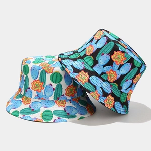 Close-up of double-sided bucket hats with cactus floral print in black and white canvas