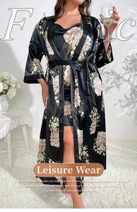 Detail of black silk floral sleepwear set with long robe and printed slip dress